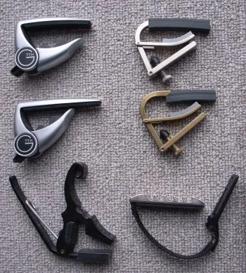 Guitar capos and slides by matsuyuki, on Flickr: http://www.flickr.com/photos/matsuyuki/4102164747/ guitar capo
